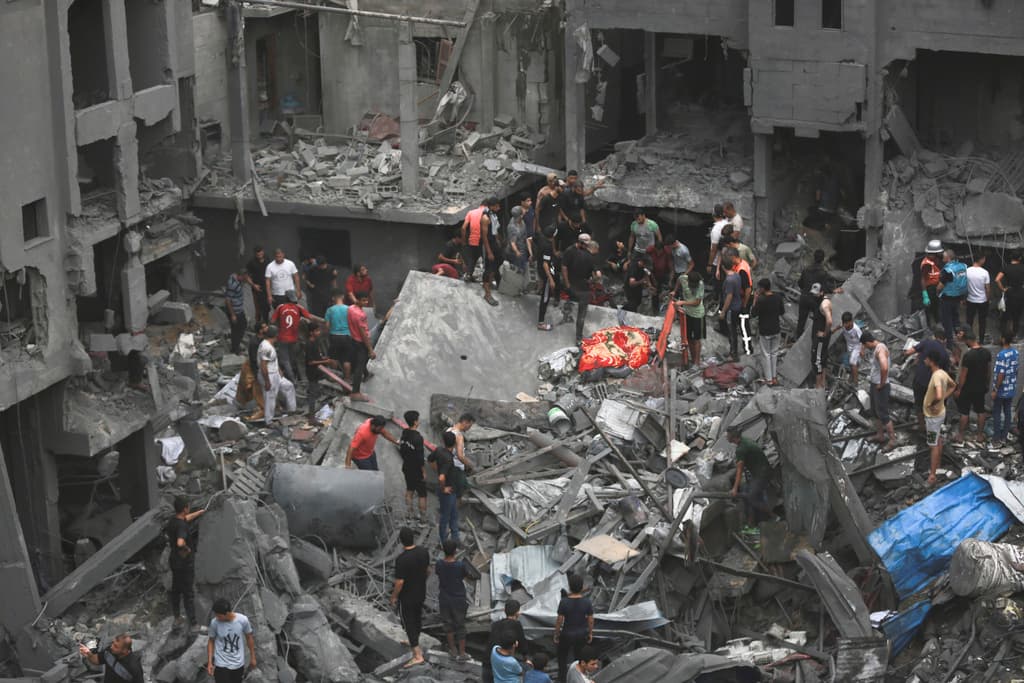 AP/Abed Khaled Damaged buildings following Israeli airstrikes on Gaza City, October 27, 2023.